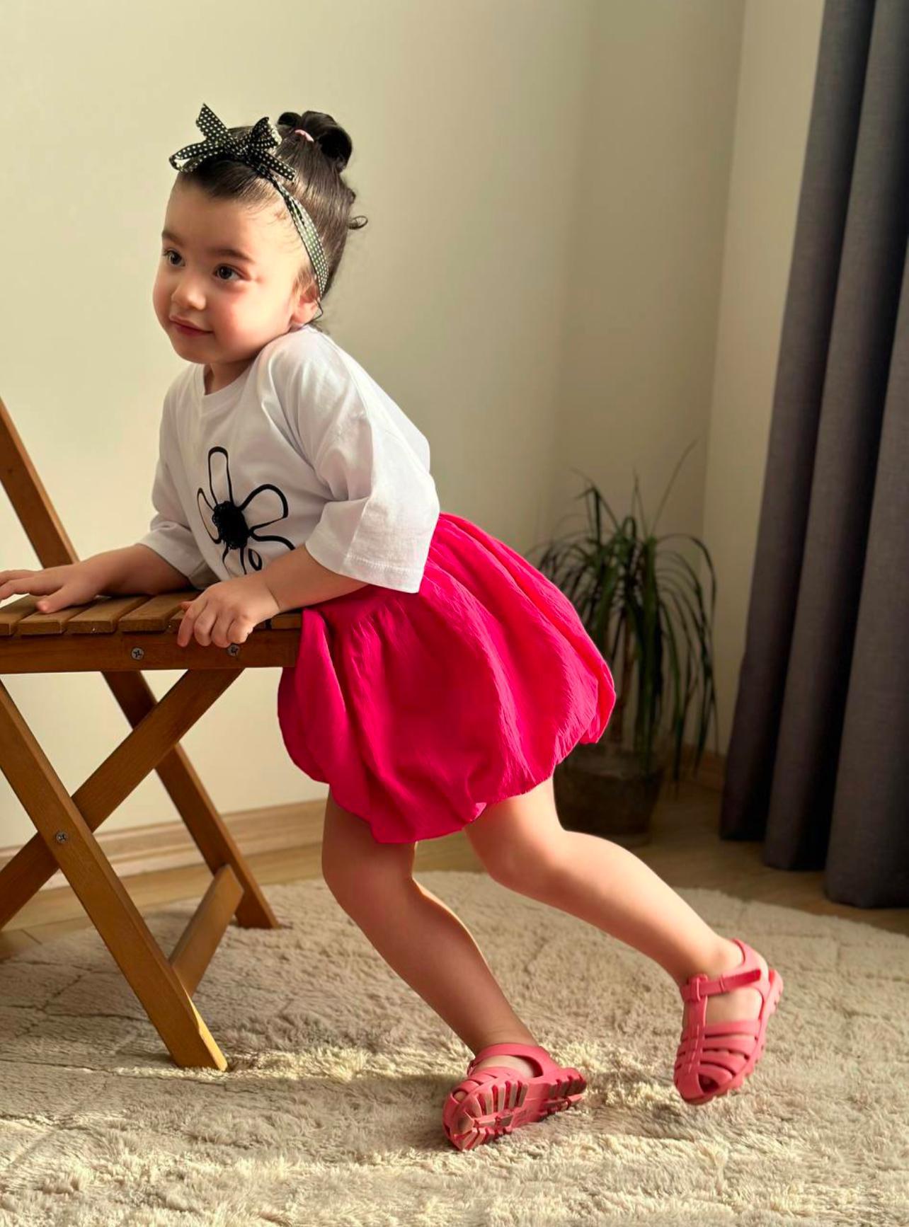 Girls White Tshirt with Black Flower and Fuchsia skirt