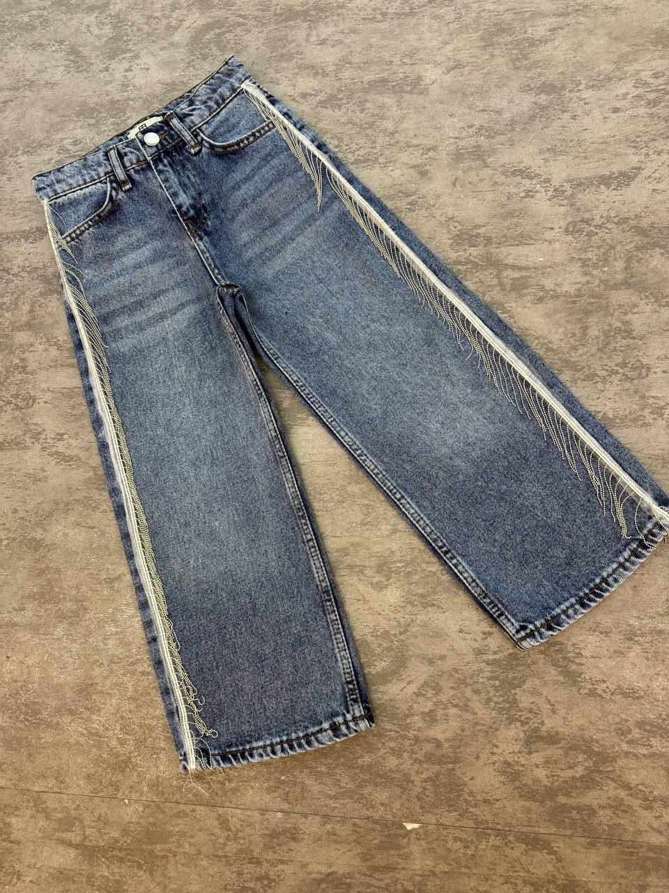 Girl blue jeans with frill